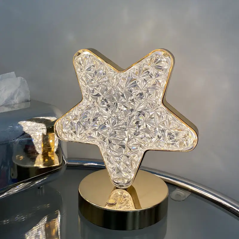 Lampada da tavolo a forma di stella
